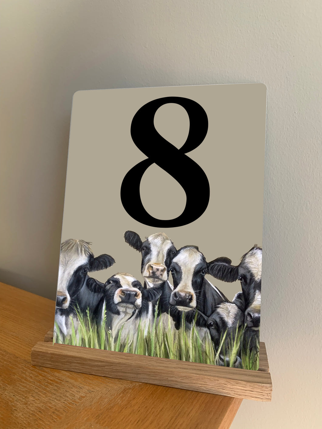 Row of Friesian Cows Table Number